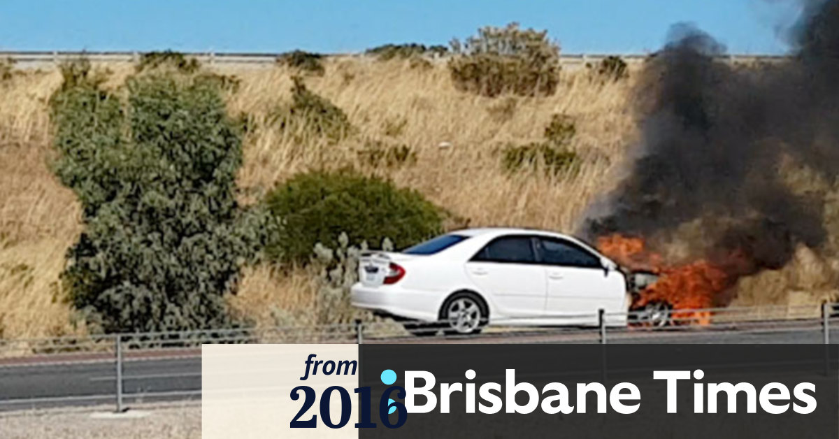 Video Car bursts into flames near freeway